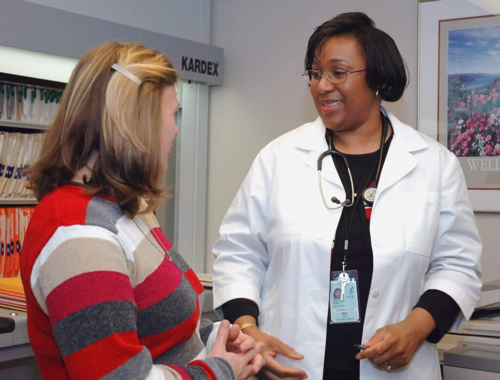 a woman speaking to a lactation consultant