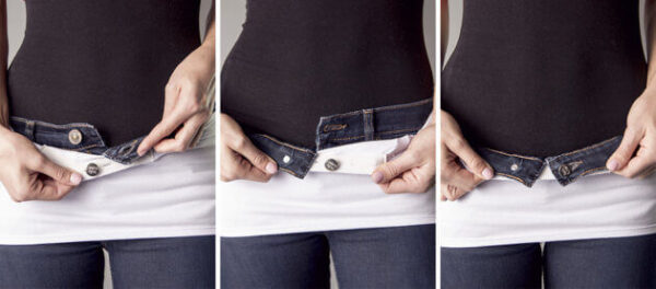 a pregnant woman wearing a belly button band