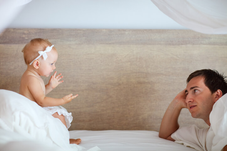 a baby talking to her dad