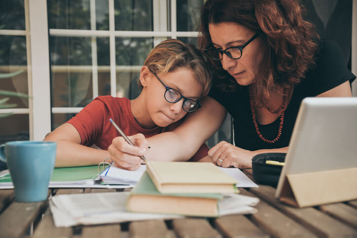 Young student doing homework at home