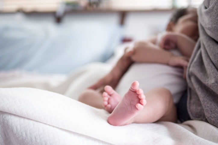 Horizontal , mother feed baby with breast milk