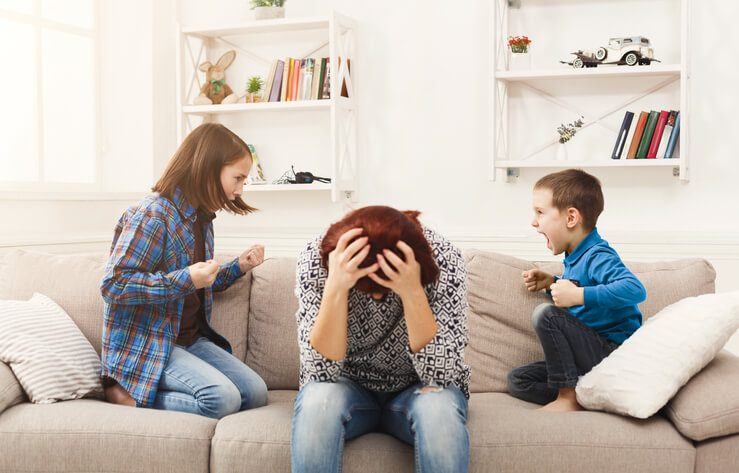 Kids having quarrel over tired mother