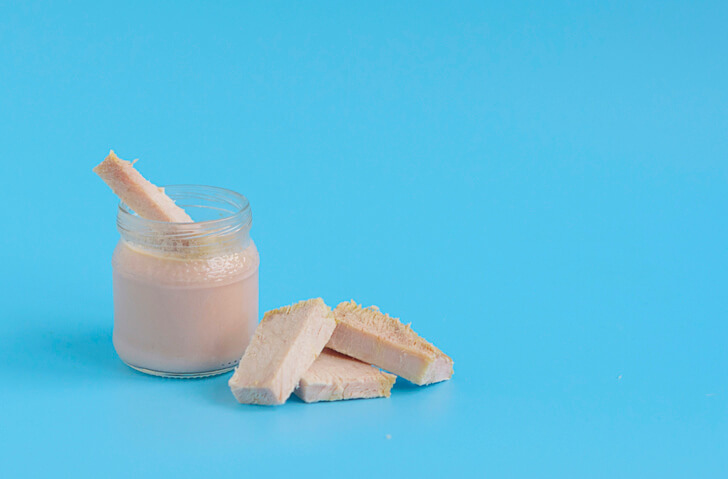 a jar filled with pureed chicken baby food