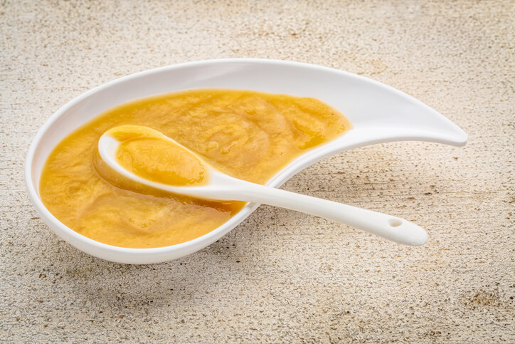 a bowl of sweet potato baby puree food