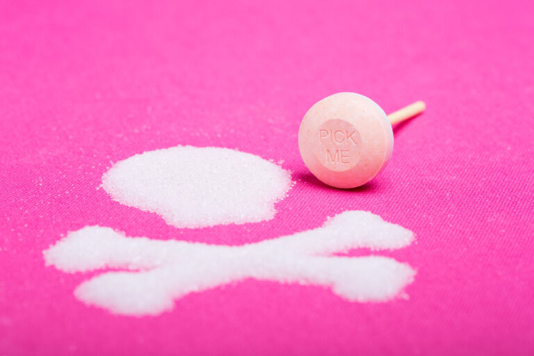 Sugary lollipop with sugar skull and crossbones