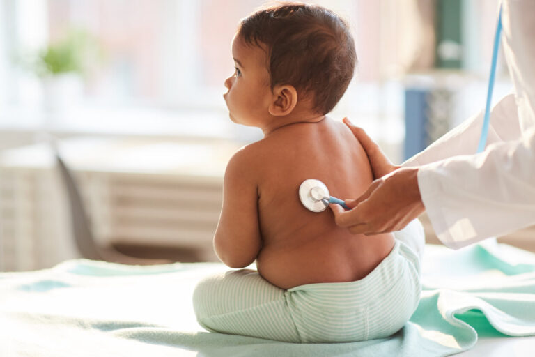 Toddler being examine by the doctor