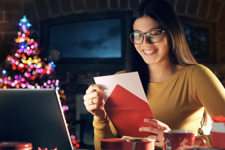 a woman creating some holiday cards