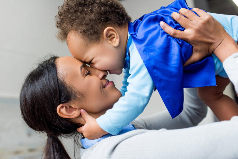 a mom and her toddler son cuddling