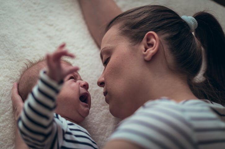 Mother calming her crying baby boy