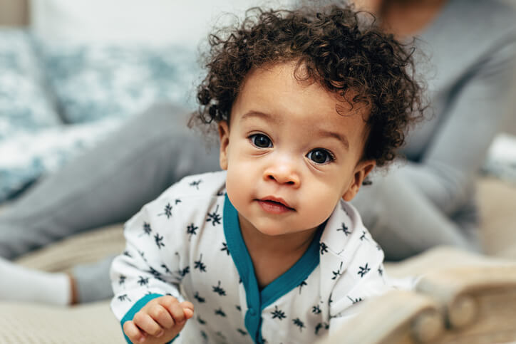 a cute baby boy crawling