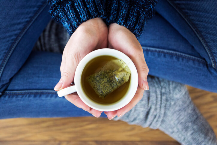 Woman having a cup of herbal tea