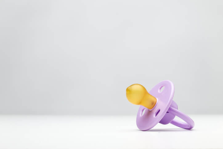 a single purple pacifier