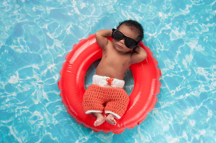 Newborn Baby Boy Floating on a Swim Ring