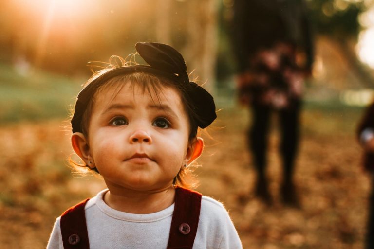 a baby outside playing during September