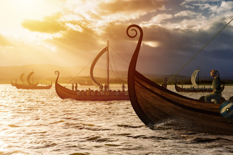 Viking ships on the water under the sunlight and dark storm