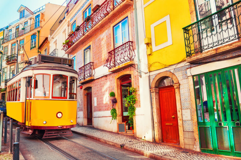 Yellow vintage tram on the street in Lisbon, Portugal